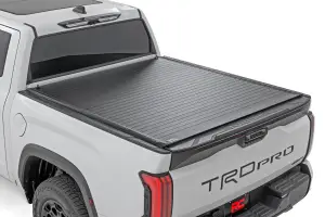 Rough Country - 50514551 | Rough Country Hard Roll Up Bed Cover For Toyota Tundra 2WD/4WD | 5'7" Bed