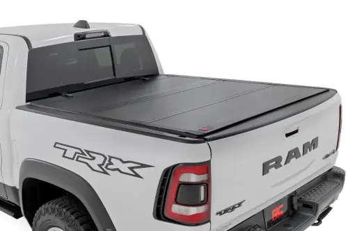 Rough Country - 49320550 | Rough Country Hard Tri-Fold Flip Up Bed Cover For Ram 1500 / 1500 TRX | 5'7" Bed