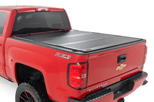 Rough Country - 49119551 | Rough Country Hard Tri-Fold Flip Up Bed Cover (2014-2018 Silverado, Sierra 1500 2WD/4WD | 2014-2019 Silverado, Sierra 2500 HD, 3500 HD 2WD/4WD | 5'9" Bed)