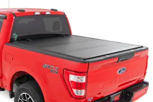 49220550 | Rough Country Hard Tri-Fold Flip Up Bed Cover (2015-2020 F150 Pickup 2WD/4WD | 5'7" Bed)