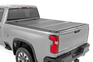 49120651 | Rough Country Hard Tri-Fold Flip Up Bed Cover Chevrolet Silverado / GMC Sierra 2500 HD & 3500 HD | 6'9" Bed
