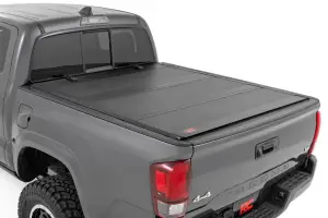 49415500 | Rough Country Hard Tri Fold Flip Up Bed Cover For Toyota Tacoma (2005-2015) | 5 Feet Bed