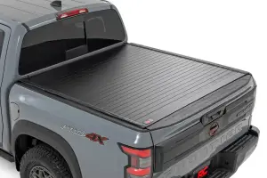 50215522 | Rough Country Hard Roll Up Bed Cover For Nissan Frontier 2WD/4WD | 5' Bed